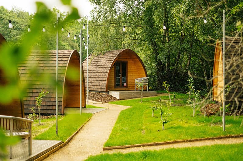 Adventure Parc Snowdonia Glamping  pods view of multiple wooden pods and the garden
