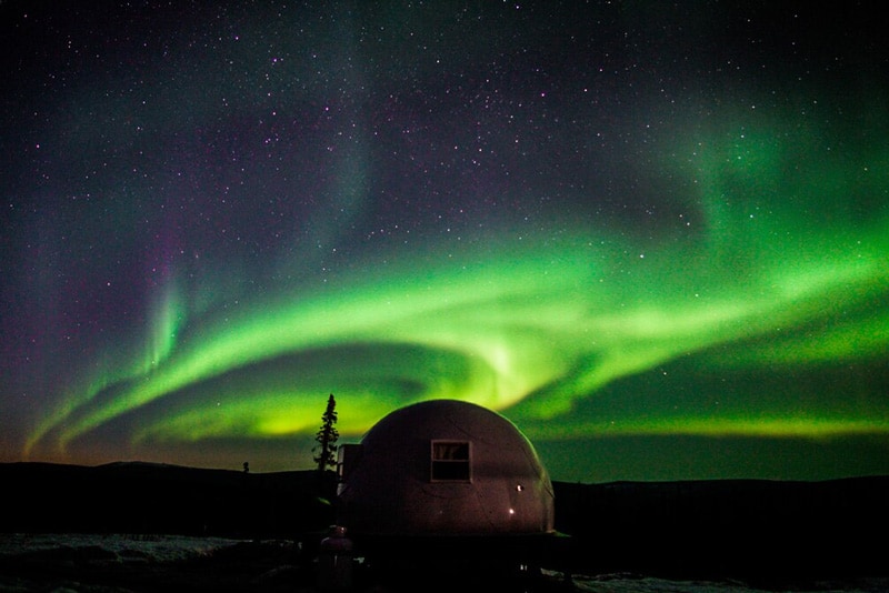 Borealis Basecamp Glamping Pod dome view at night with northern lights