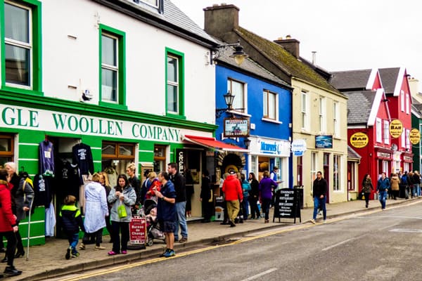 dingle village stop when glamping in Kerry view of the main street with people and colorful shops