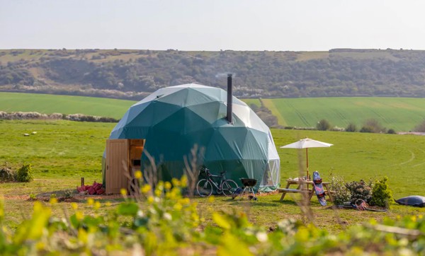 glamping dome in new forest view of outside with the English countryside around it