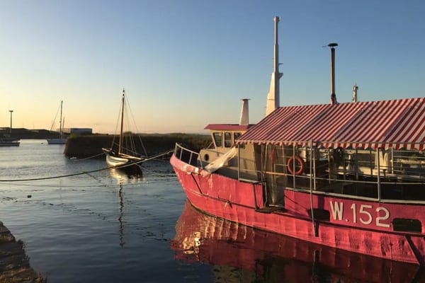 Boat Glamping with Polaris Popcorn when Glamping Galway with a view of the marina and the houseboat