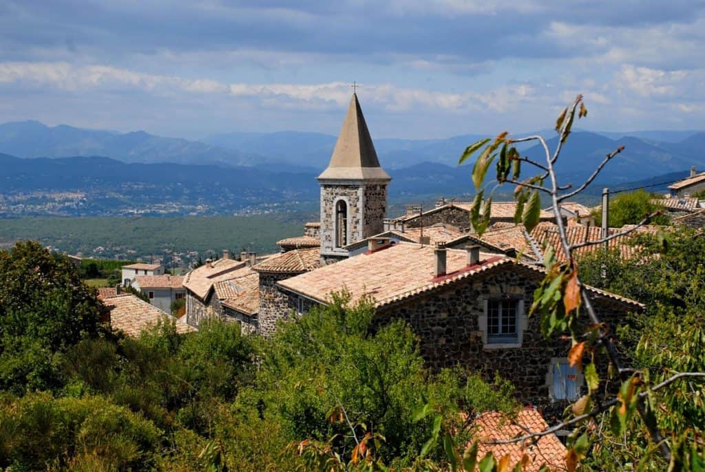 Ardèche region in France with town and mountains in the background. 
