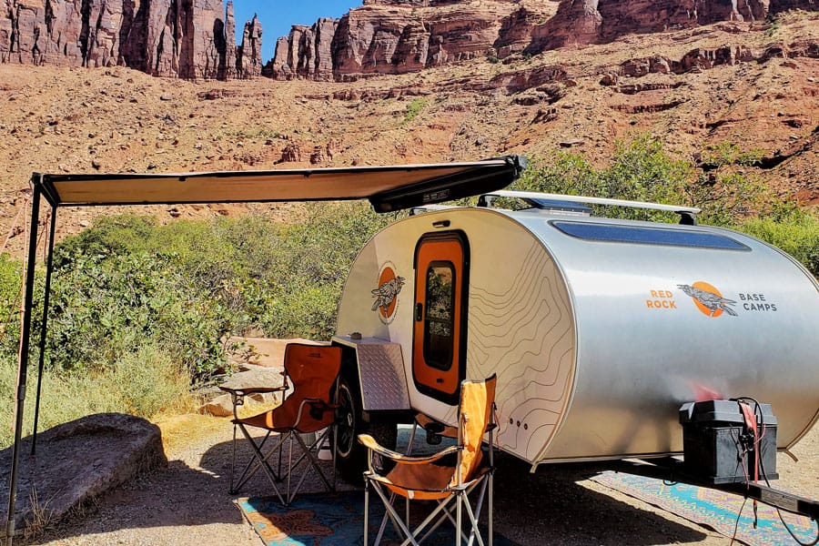 view of glamping trailer in moab with chairs and awning