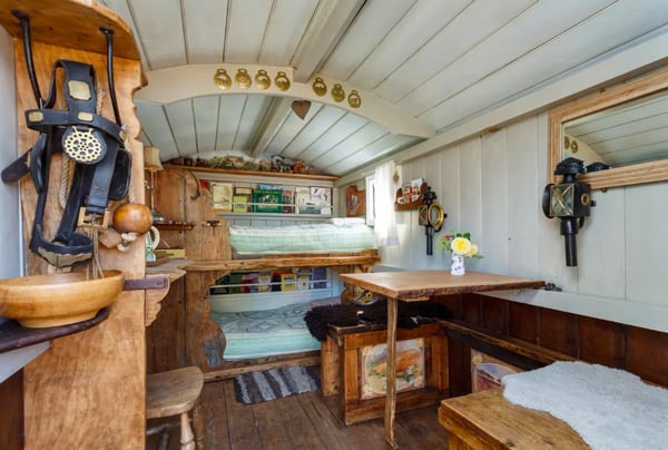 view of the inside of a glamping hut in New Forest. Bunk Bed, table and decorations