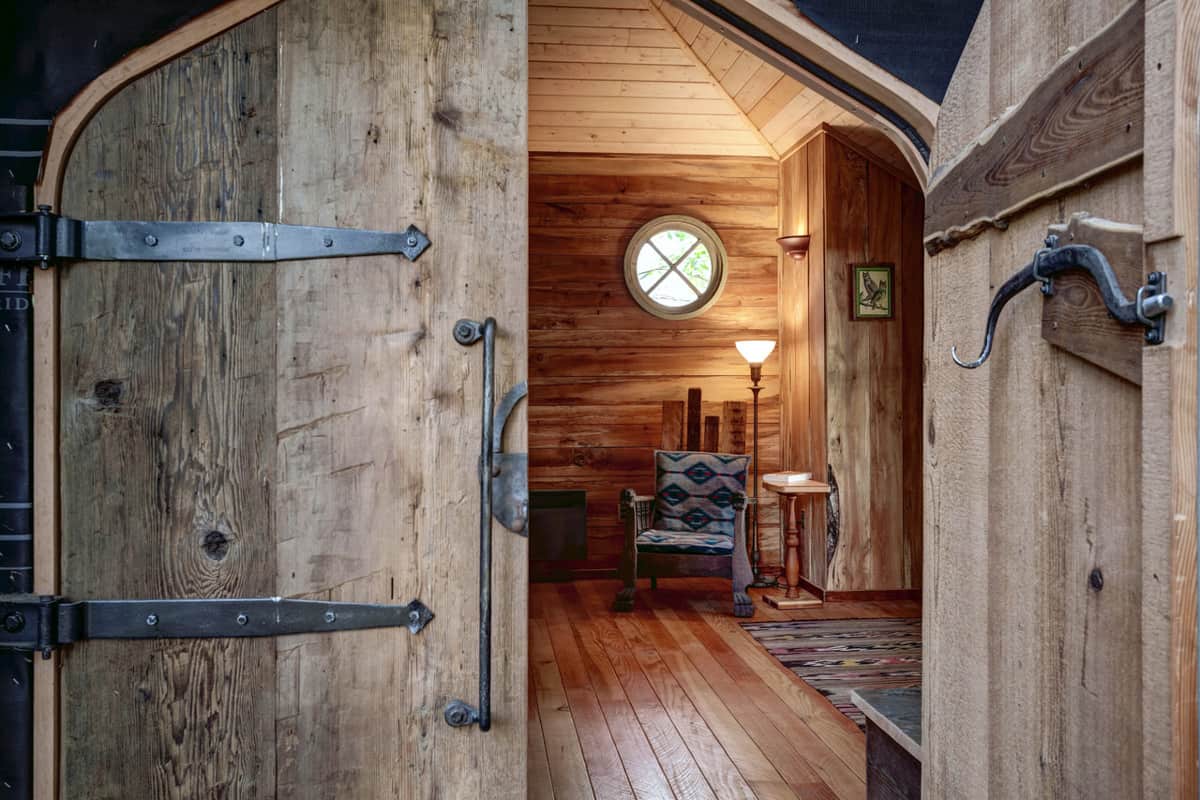 Wooden door entry to glamping treehouse in Washington