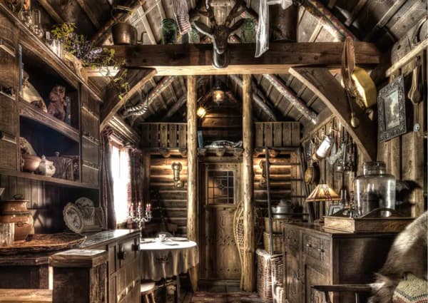 The Trapper's Glamping Cabin at Talliston view of the inside with hunting decorations and wood furnishings