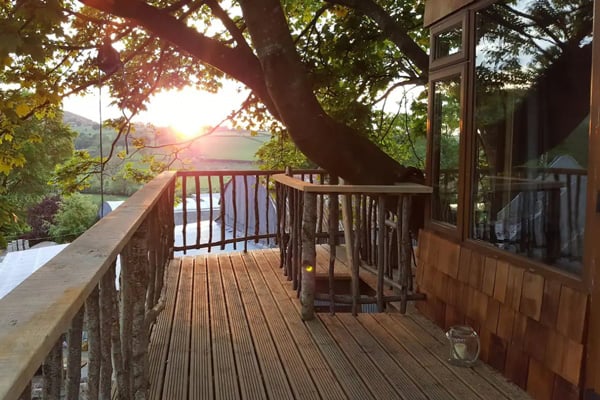 Tuckmill Treehouse Glamping Ireland view of deck with Irish countryside behind