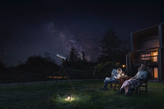 Ventana Big Sur Glamping Resort stargazing two people sitting with telescope watching the night sky