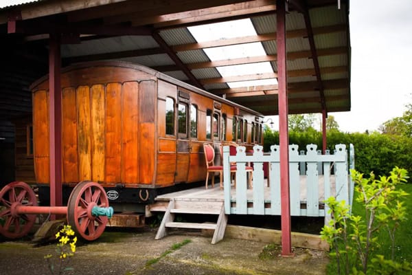 Victorian Railway Carriage Glamping Essex view of the carriage and deck